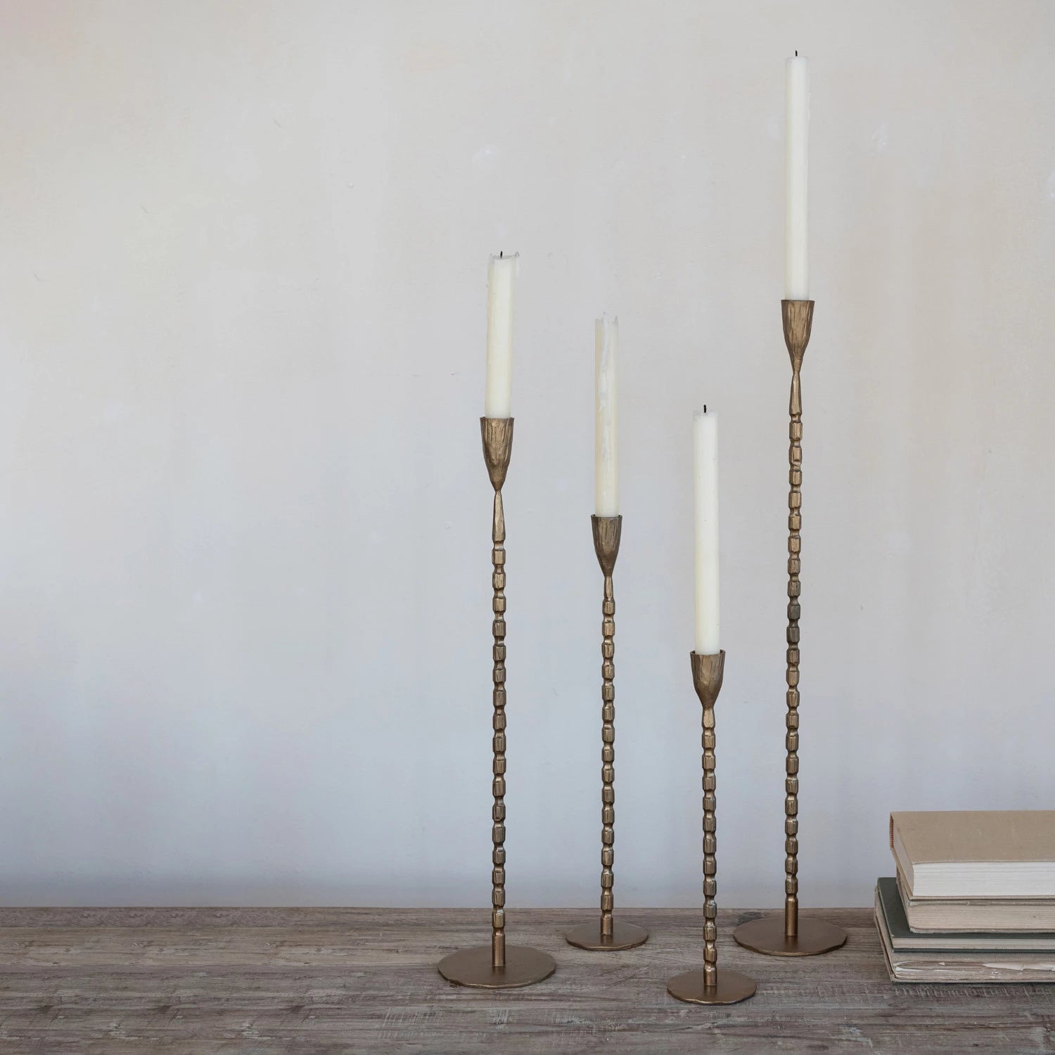 Beaded Tapers with white candles arranged on stand