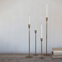 Beaded Tapers with white candles arranged on stand